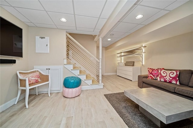9 Casey Ct, Newport, RI 02840 - living room with a drop ceiling, wood finished floors, baseboards, stairs, and recessed lighting