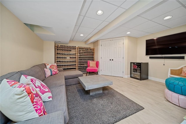 9 Casey Ct, Newport, RI 02840 - living area featuring wood finished floors, baseboards, recessed lighting, and a drop ceiling