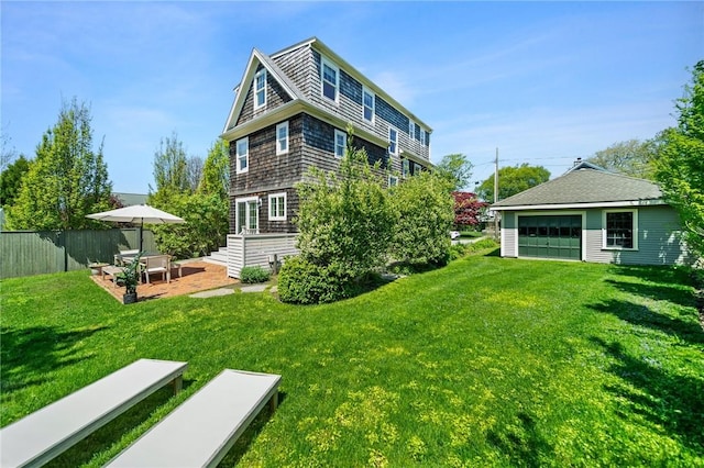 9 Casey Ct, Newport, RI 02840 - rear view of property with a garage and a patio