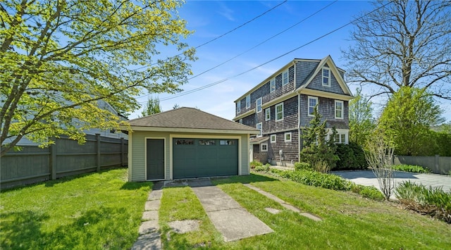 9 Casey Ct, Newport, RI 02840 - view of front of home featuring an outdoor structure and a detached garage