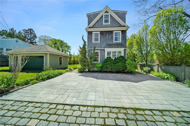 9 Casey Ct, Newport, RI 02840 - back of house with fence, an outbuilding, a garage, and a patio area