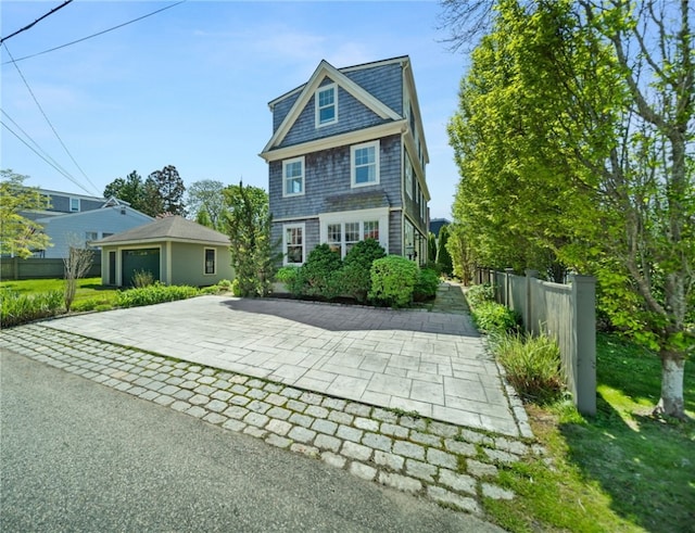 9 Casey Ct, Newport, RI 02840 - view of front facade featuring fence and an outbuilding