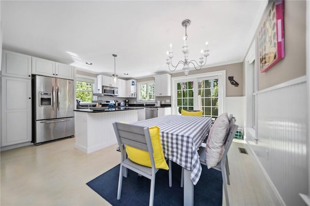 9 Casey Ct, Newport, RI 02840 - dining room with a chandelier, a wainscoted wall, recessed lighting, and ornamental molding