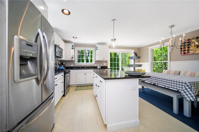 9 Casey Ct, Newport, RI 02840 - kitchen featuring stainless steel appliances, dark countertops, healthy amount of natural light, white cabinets, and recessed lighting