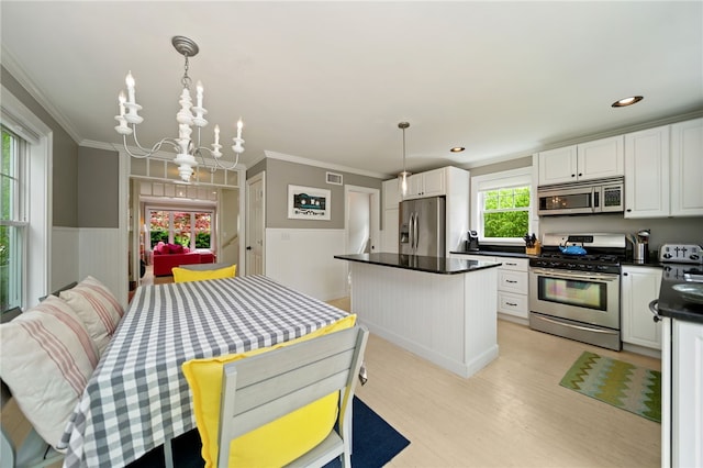 9 Casey Ct, Newport, RI 02840 - dining area featuring a chandelier, crown molding, light wood-style floors, and recessed lighting