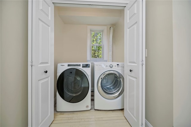 9 Casey Ct, Newport, RI 02840 - laundry area featuring washing machine and dryer and wood finished floors