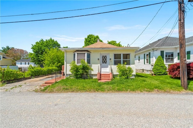 bungalow-style home featuring entry steps