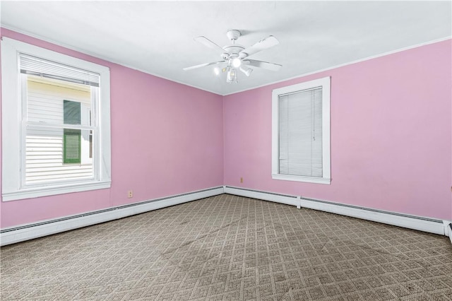 spare room with ceiling fan, carpet flooring, baseboards, crown molding, and baseboard heating