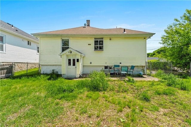 back of house with a patio