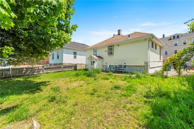 rear view of property with a chimney