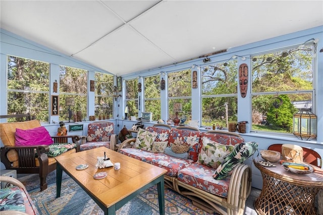 sunroom / solarium featuring plenty of natural light and vaulted ceiling