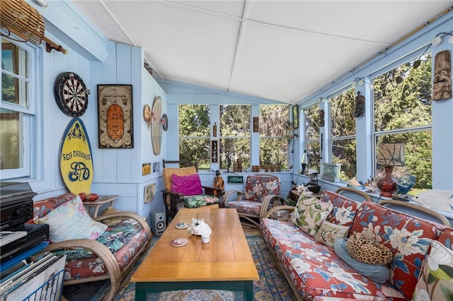 sunroom featuring vaulted ceiling and outdoor lounge area