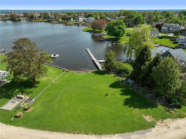 aerial view of residential area featuring a nearby body of water