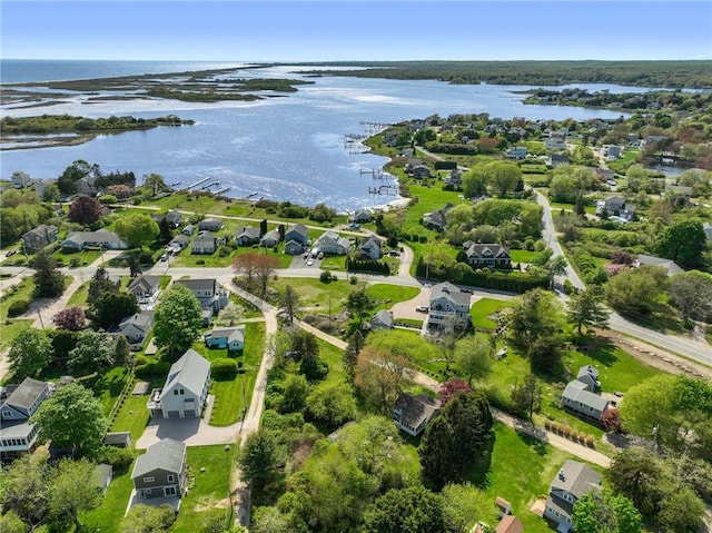 aerial perspective of suburban area with a nearby body of water