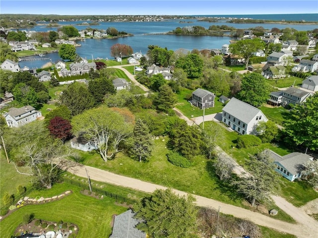 aerial view of residential area featuring a nearby body of water