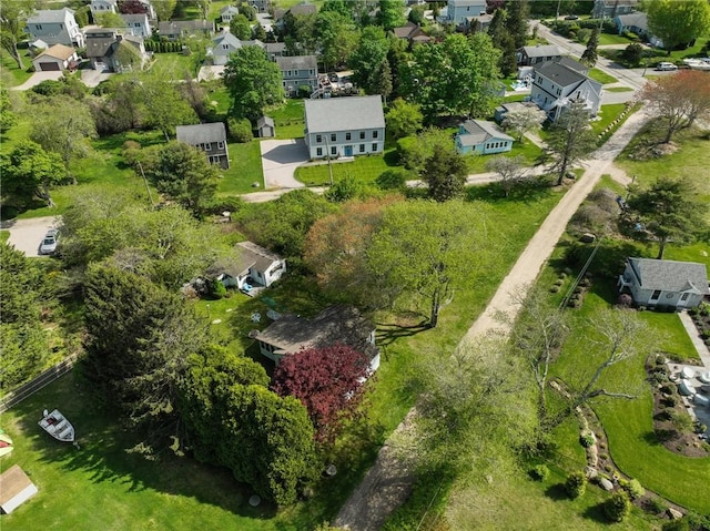 aerial view of property and surrounding area featuring nearby suburban area
