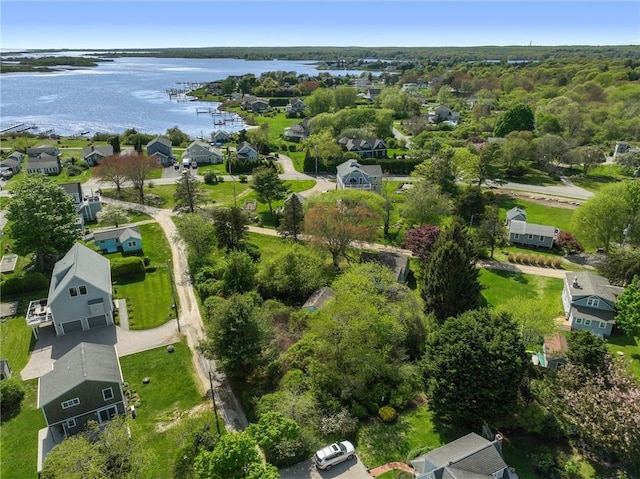 aerial overview of property's location with a large body of water and nearby suburban area