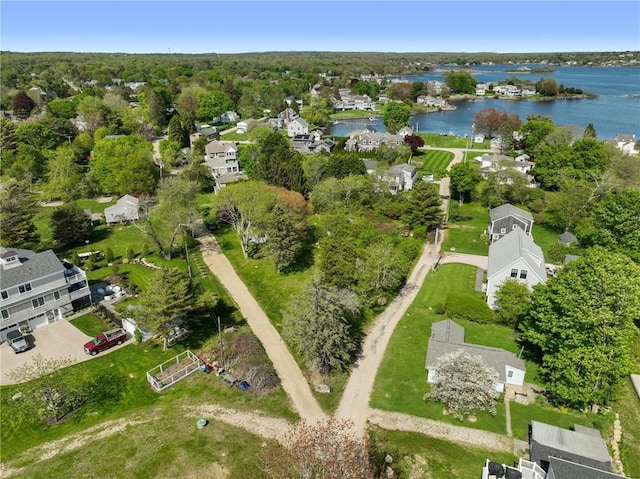 aerial overview of property's location featuring a nearby body of water and nearby suburban area