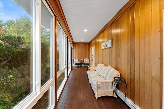 6 Windward Cir, Narragansett, RI 02882 - sunroom / solarium featuring wood walls, hardwood / wood-style flooring, and a baseboard radiator