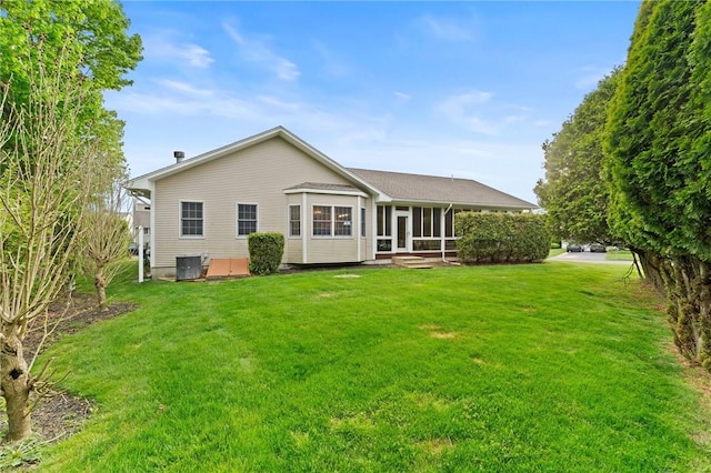 6 Windward Cir, Narragansett, RI 02882 - rear view of house featuring a sunroom, a yard, and central AC