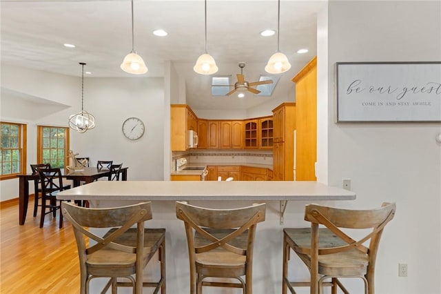 6 Windward Cir, Narragansett, RI 02882 - kitchen featuring electric range oven, a ceiling fan, white microwave, recessed lighting, and light wood finished floors