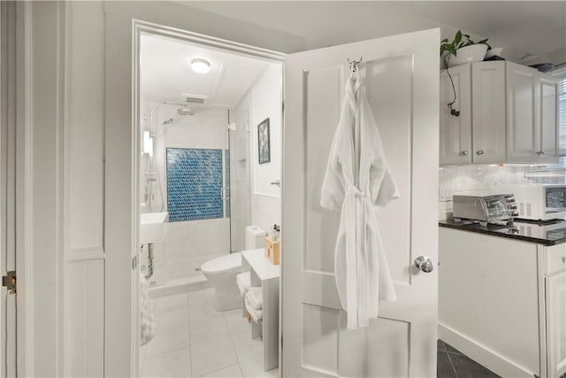 33 Marsh St Unit 1, Newport, RI 02840 - full bath with a shower stall, tasteful backsplash, and toilet