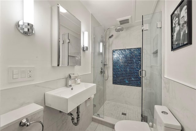 33 Marsh St Unit 1, Newport, RI 02840 - bathroom with toilet, a shower stall, a sink, and tile walls