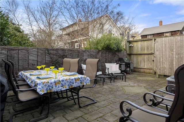 33 Marsh St Unit 1, Newport, RI 02840 - view of patio / terrace featuring a fenced backyard, outdoor dining space, and a grill