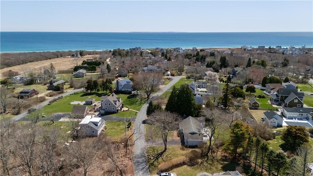 view of property location featuring nearby suburban area and a nearby body of water