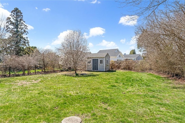 view of yard featuring a storage unit and an outdoor structure