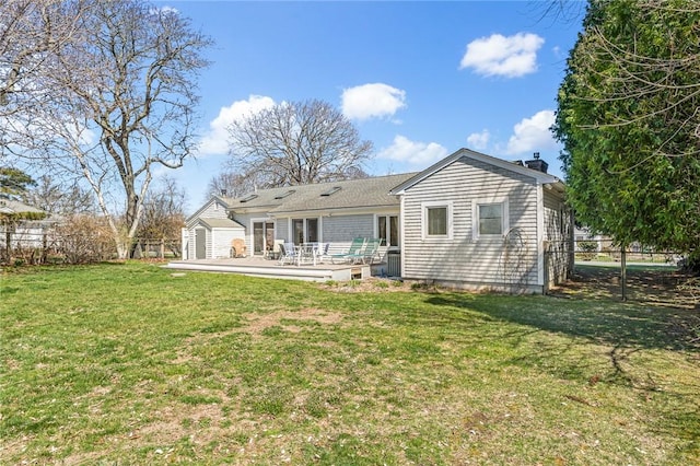 rear view of house with a wooden deck