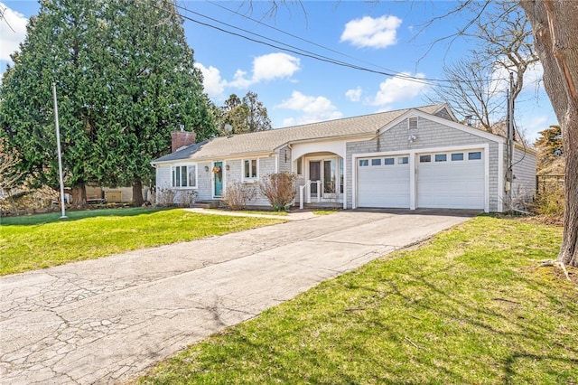 ranch-style home with a garage, a chimney, asphalt driveway, and a front lawn