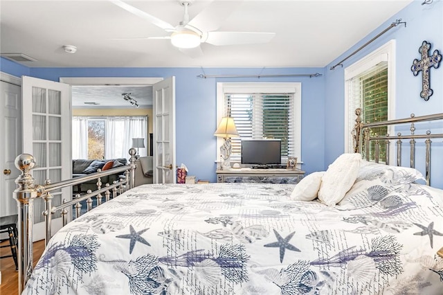 bedroom featuring wood finished floors and ceiling fan