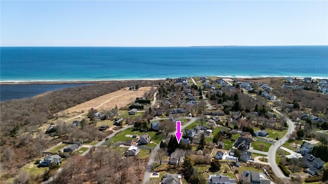 aerial view of property and surrounding area featuring expansive beach