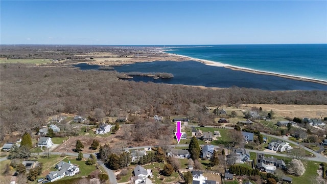 aerial view of property and surrounding area with extended coastline and nearby suburban area
