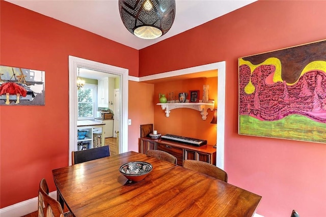dining room featuring baseboards