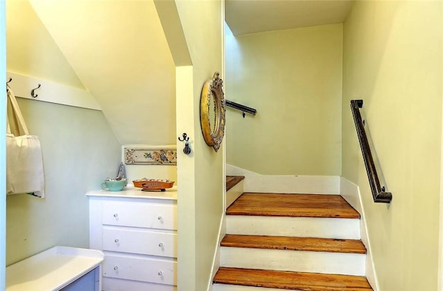 stairs with lofted ceiling