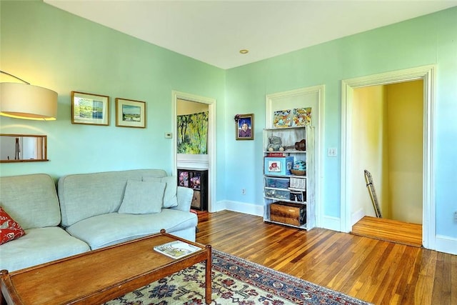 living room with wood finished floors and baseboards