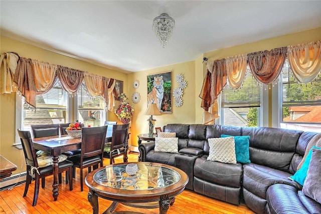 10 Westcott Ave Unit 3, Boston, MA 02124 - living area featuring light wood-type flooring and a baseboard heating unit