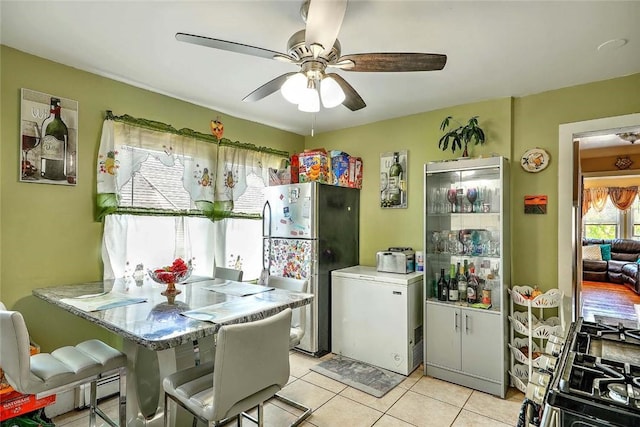 10 Westcott Ave Unit 3, Boston, MA 02124 - kitchen with freestanding refrigerator, fridge, a ceiling fan, and light tile patterned flooring