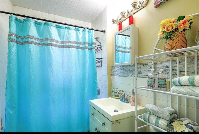 10 Westcott Ave Unit 3, Boston, MA 02124 - bathroom featuring tile walls, vanity, and curtained shower