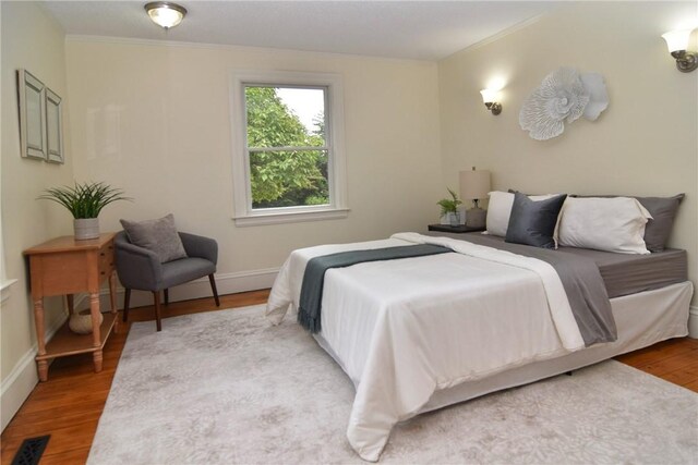 244 Kingstown Rd, Narragansett, RI 02882 - bedroom featuring crown molding, wood finished floors, and baseboards