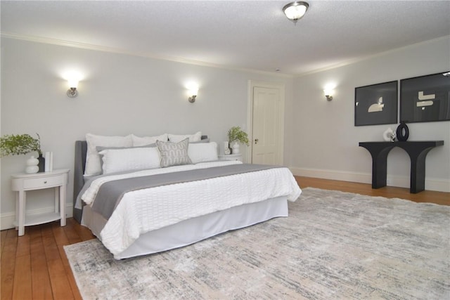 244 Kingstown Rd, Narragansett, RI 02882 - bedroom with ornamental molding, wood finished floors, and baseboards