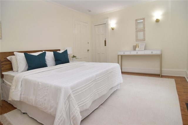 244 Kingstown Rd, Narragansett, RI 02882 - bedroom with wood finished floors, ornamental molding, and baseboards