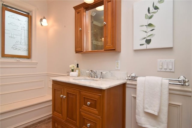244 Kingstown Rd, Narragansett, RI 02882 - bathroom featuring vanity, wainscoting, and a shower