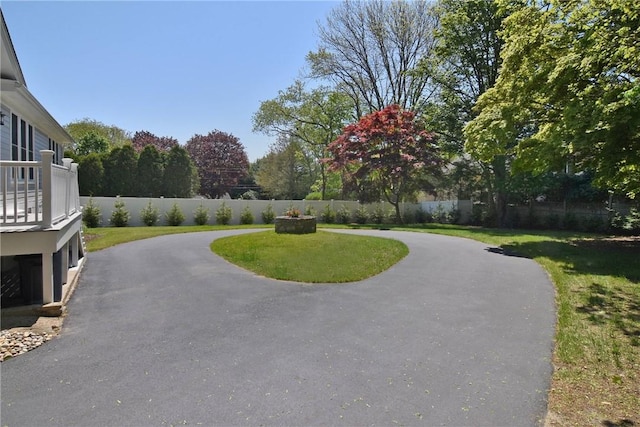 244 Kingstown Rd, Narragansett, RI 02882 - view of yard featuring a patio area, driveway, and an attached garage