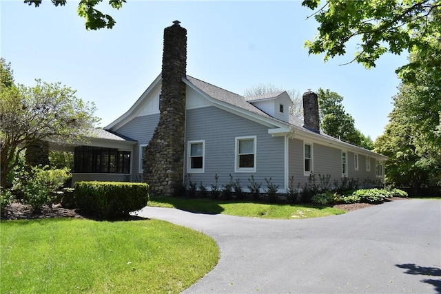 244 Kingstown Rd, Narragansett, RI 02882 - view of property exterior with a chimney and a yard