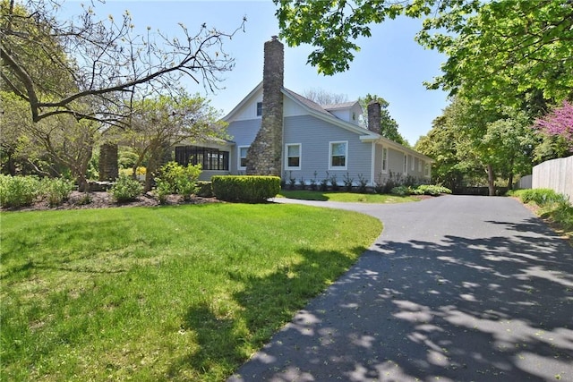 244 Kingstown Rd, Narragansett, RI 02882 - view of side of property featuring driveway and a chimney