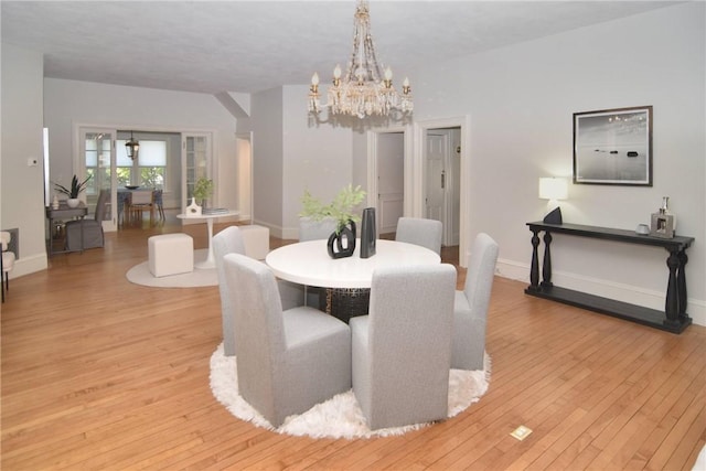 244 Kingstown Rd, Narragansett, RI 02882 - dining area with a chandelier, light wood-style flooring, and baseboards
