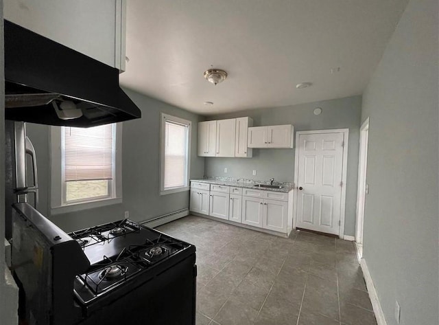 184 Wadsworth St, Providence, RI 02909 - kitchen with black range with gas stovetop, a baseboard radiator, a sink, white cabinetry, and under cabinet range hood